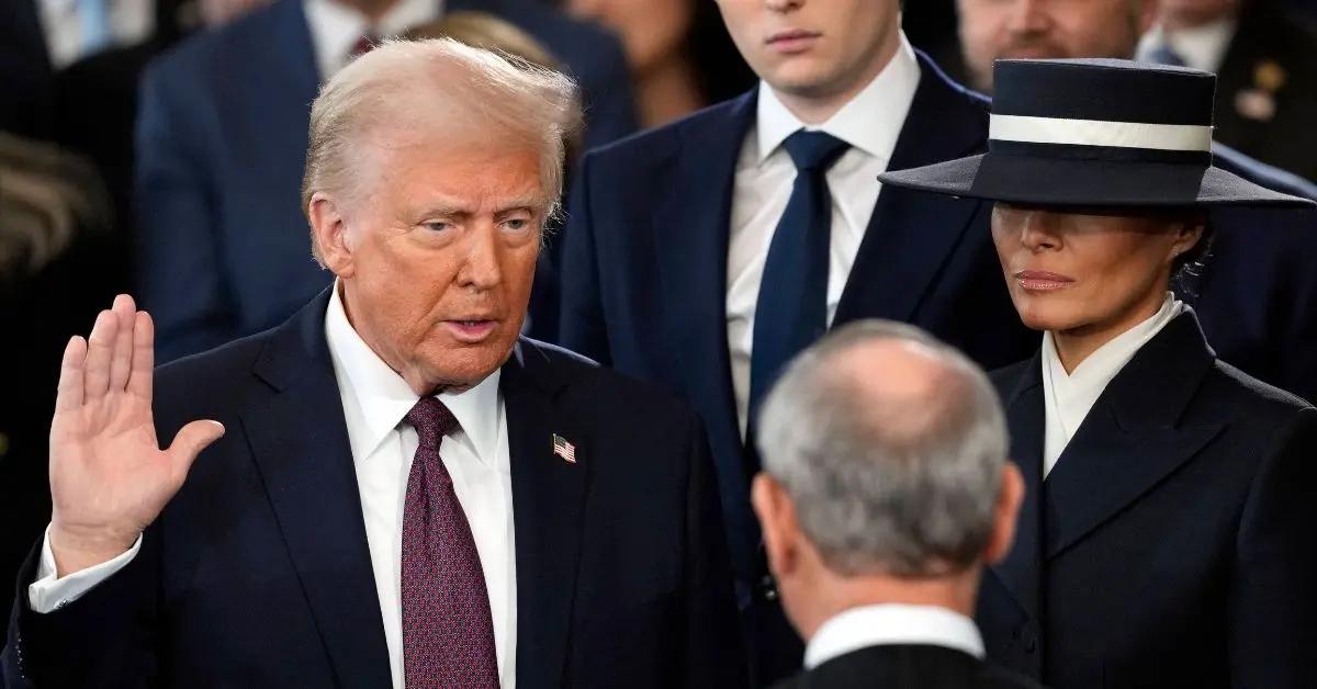 Photo of Donald and Melania Trump shared an air kiss at his January 2025 inauguration.