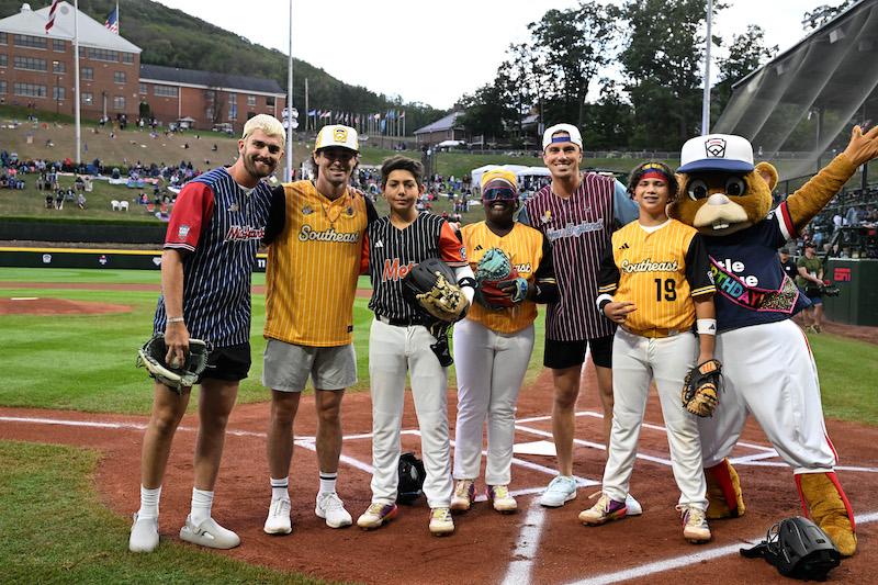 jackson olson ryan cox and david meadows of the savannah bananas pictured on field at the  little league world series