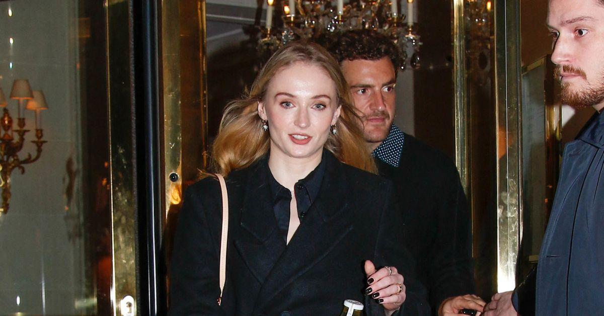 image of Sophie Turner and Peregrine Pearson packed on the PDA while walking through Notting Hill.