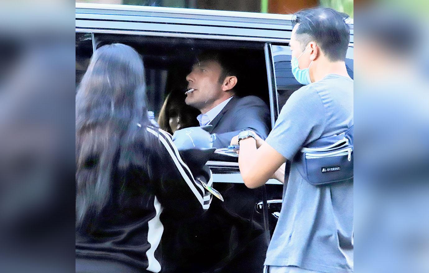 ben affleck smokes cigarette signs autographs at a red light while leaving the tender bar premiere jennifer lopez