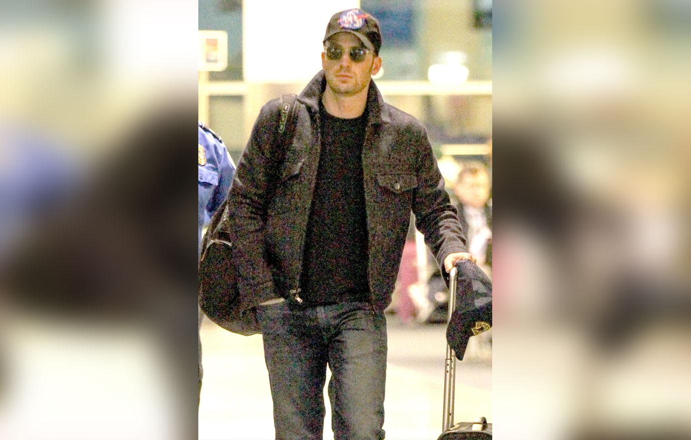 *EXCLUSIVE* Chris Evans arrives in Boston with luggage in hand