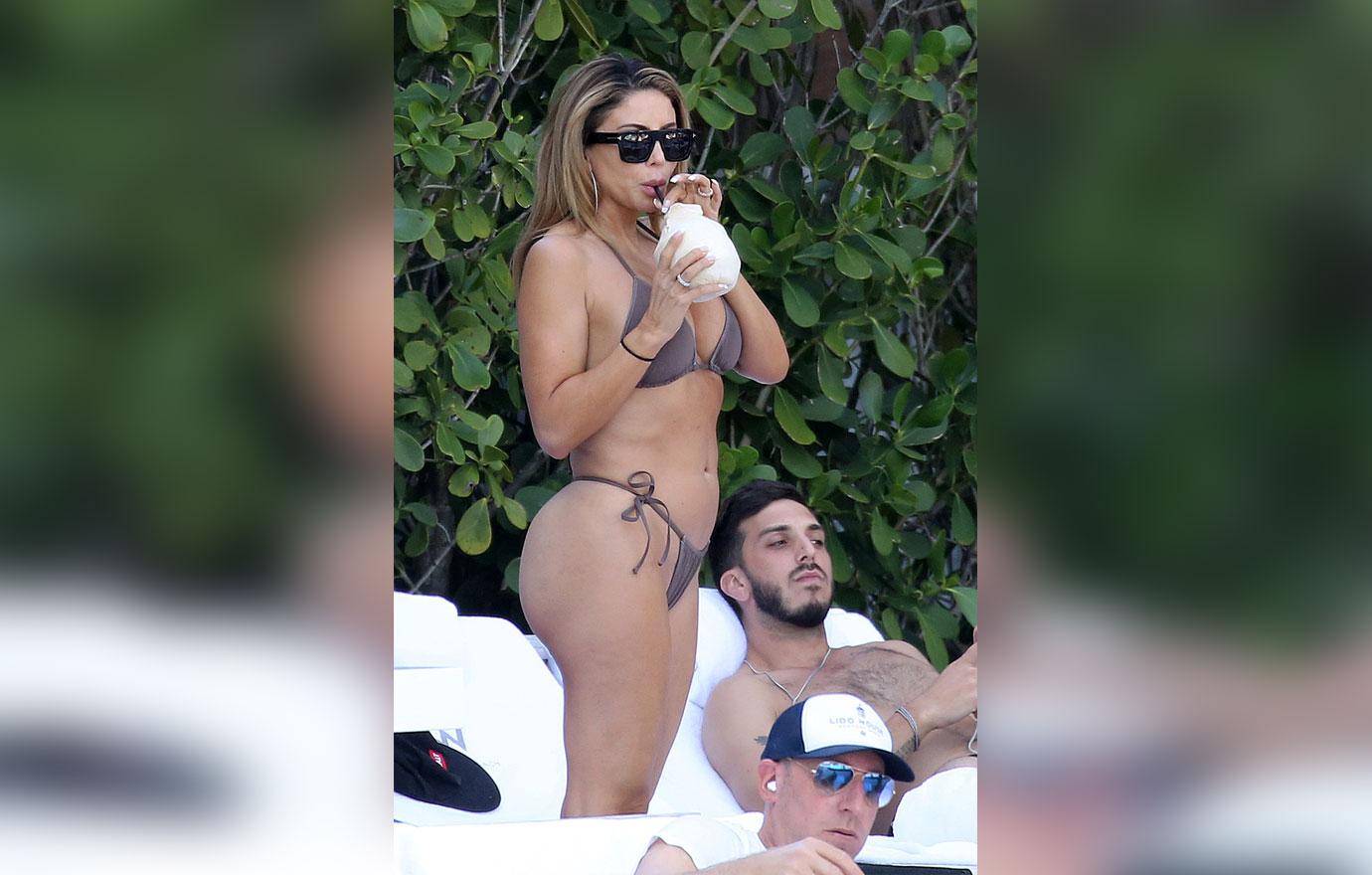 larsa pippen poolside in bikini with mystery man