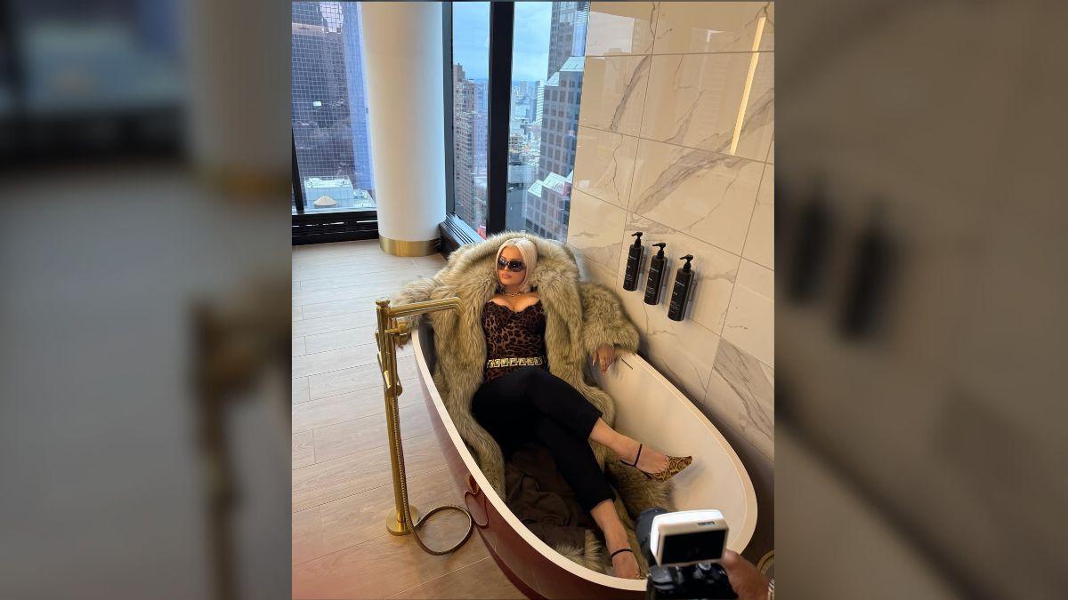 image of The pop star also posed lounging in a bathtub.