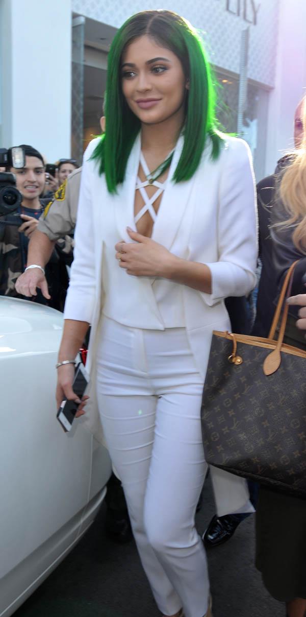 Kylie Jenner has in store for her lip liner at DASH store and Caytlin Jenner attends on Melrose, CA