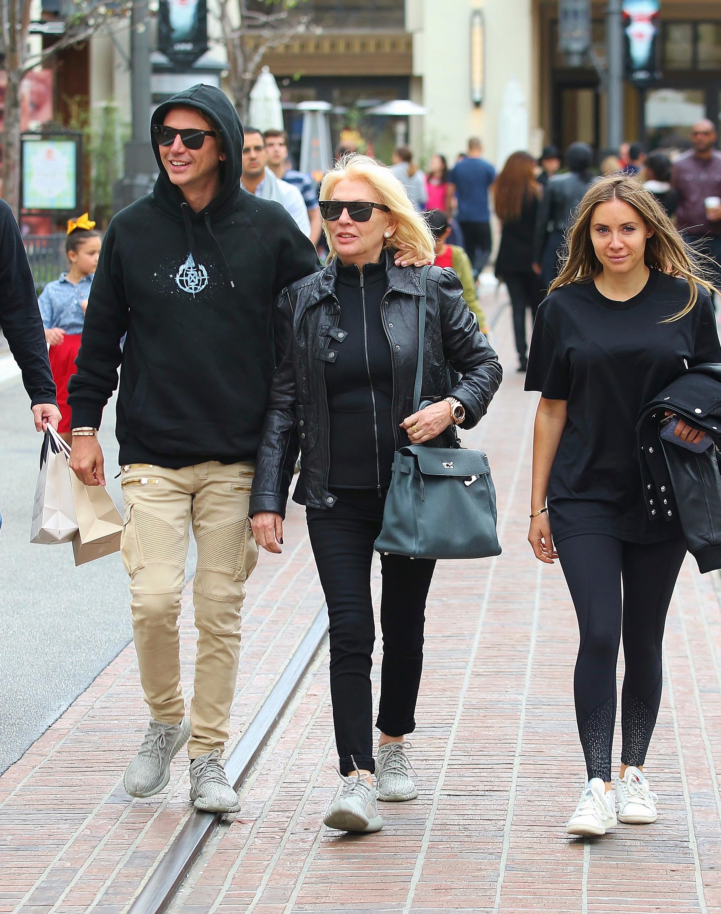 EXCLUSIVE: Jonathan Cheban and his mother wearing Adidas Yeezy 350 Boost whilst shopping at Nike Store in West Hollywood, California