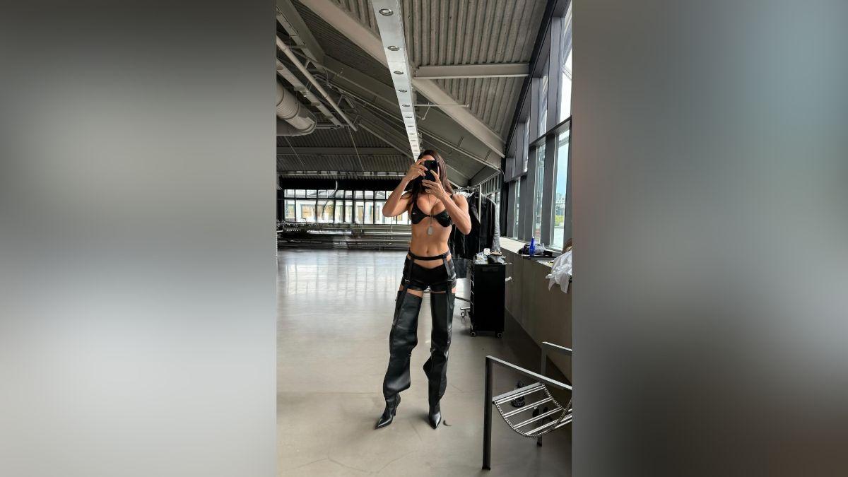 Image of Irina Shayk turned up the heat in garters and high boots.