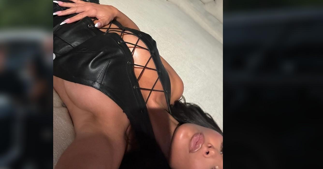 kim kardashian shows off ample assets risque leather corset photos