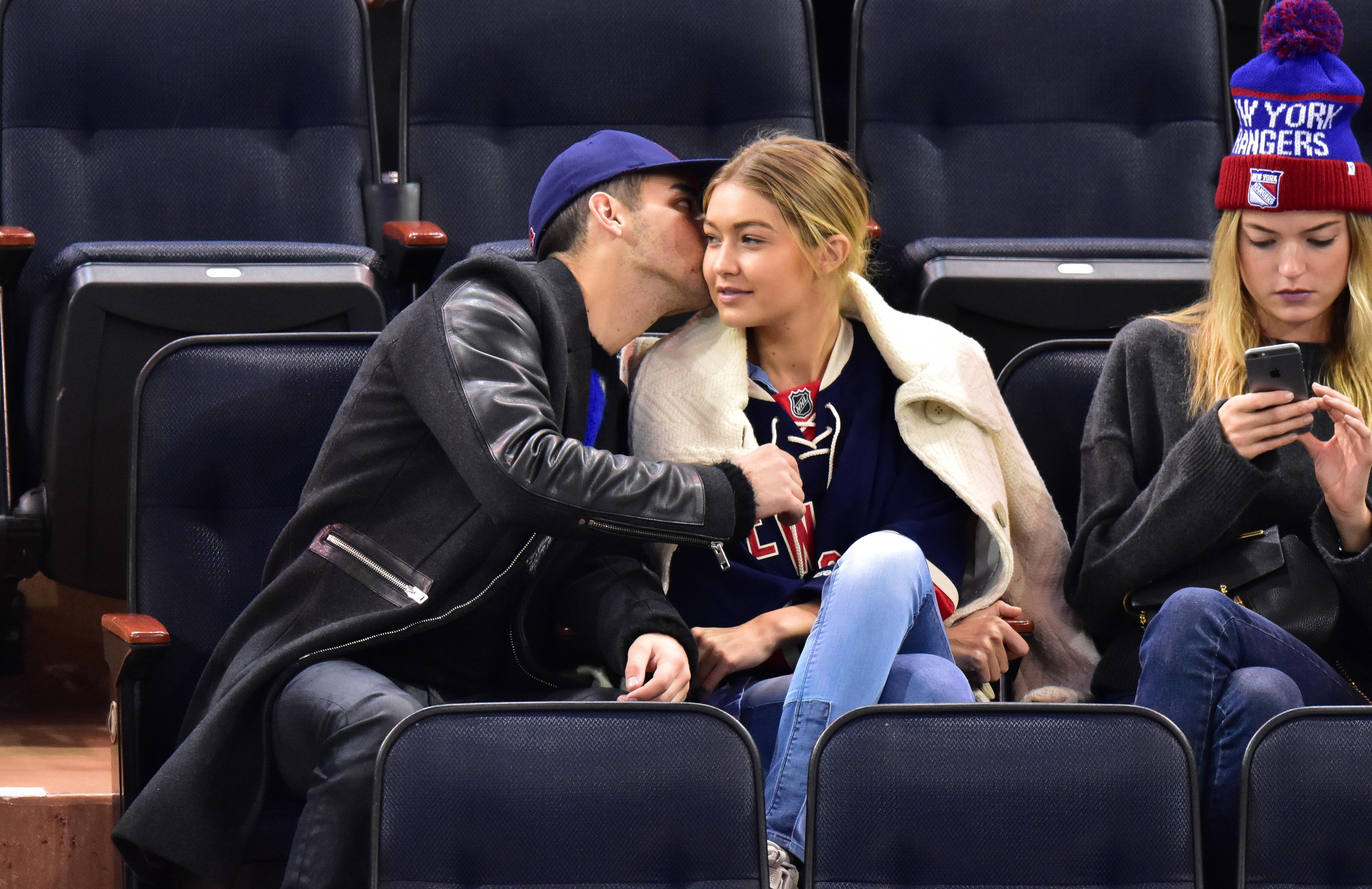 Gigi Hadid and boyfriend Joe Jonas kiss at New York Rangers game