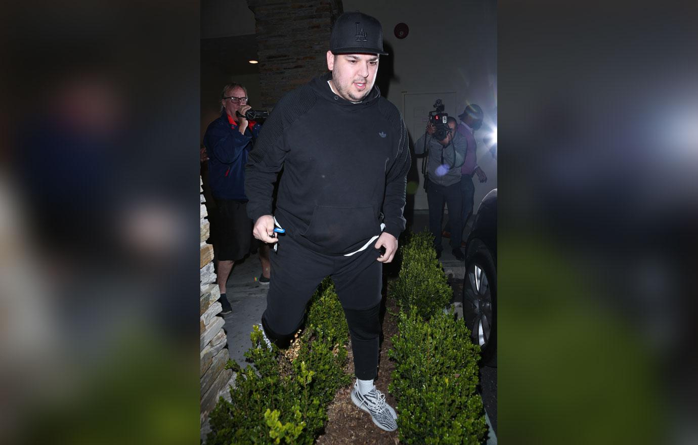 Rob Kardashian leaves the movies after a night out with his sisters and Kanye West