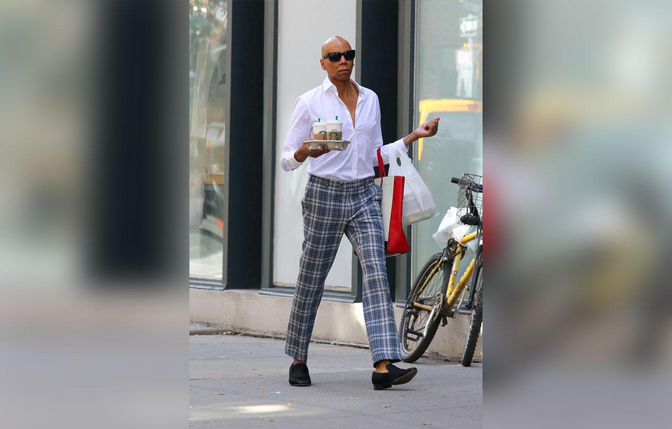 RuPaul walks the streets of Manhattan like its a runway while multitasking in NYC