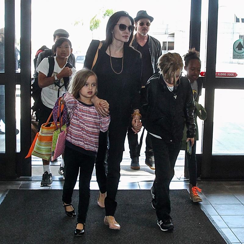 Brad Pitt and Angelina Jolie arrive at LAX with their kids *USA ONLY**