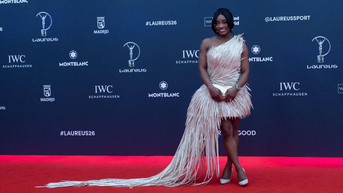 Image of Simone Biles wore a red haute couture gown while attending the wedding with Jonathan Owens.