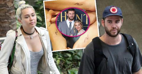 miley cyrus liam hemsworth travel brisbane matching tatoo