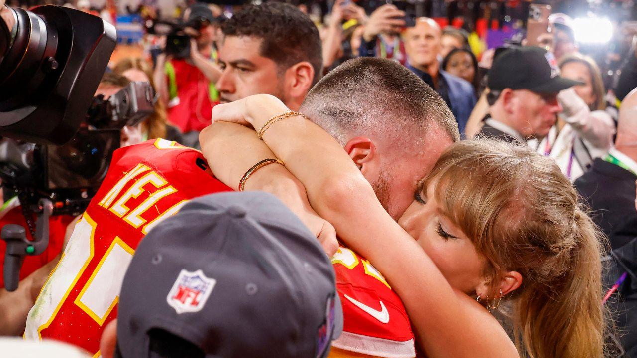 Image of Taylor Swift hugging Travis Kelce.