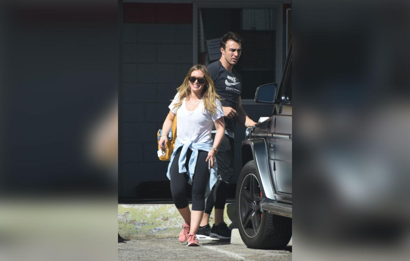 *EXCLUSIVE* Hilary Duff is all smiles as she heads to the gym with her trainer