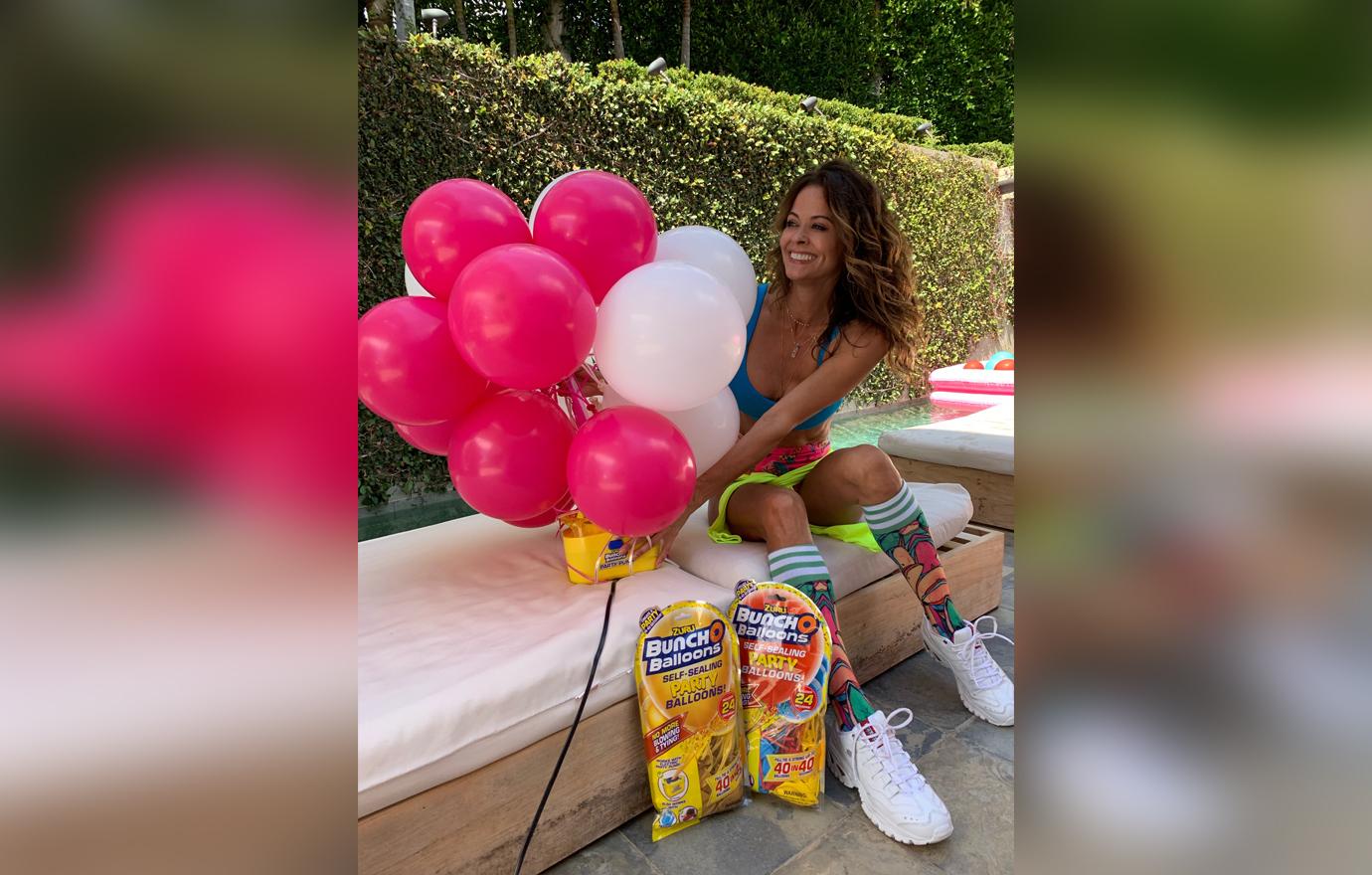 Brooke Burke Wearing Colorful Summer Look Smiling With Balloons