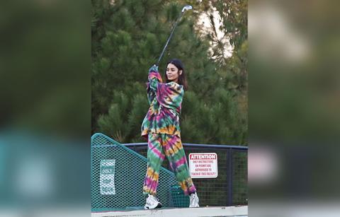 vanessa hudgens and her boyfriend cole tucker hit the driving range on new years eve