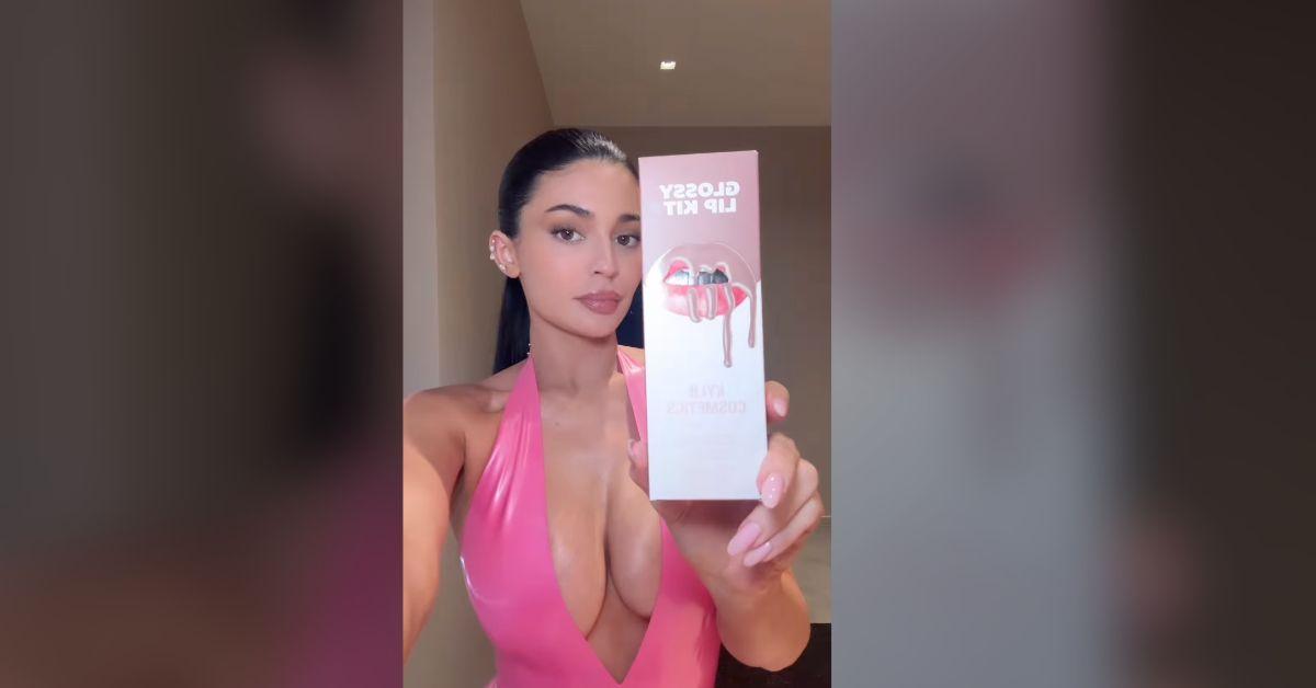 kylie jenner spills out pink dress after revealing plastic surgery secrets