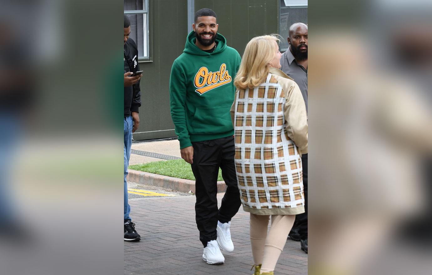 Drake in green sweatshirt