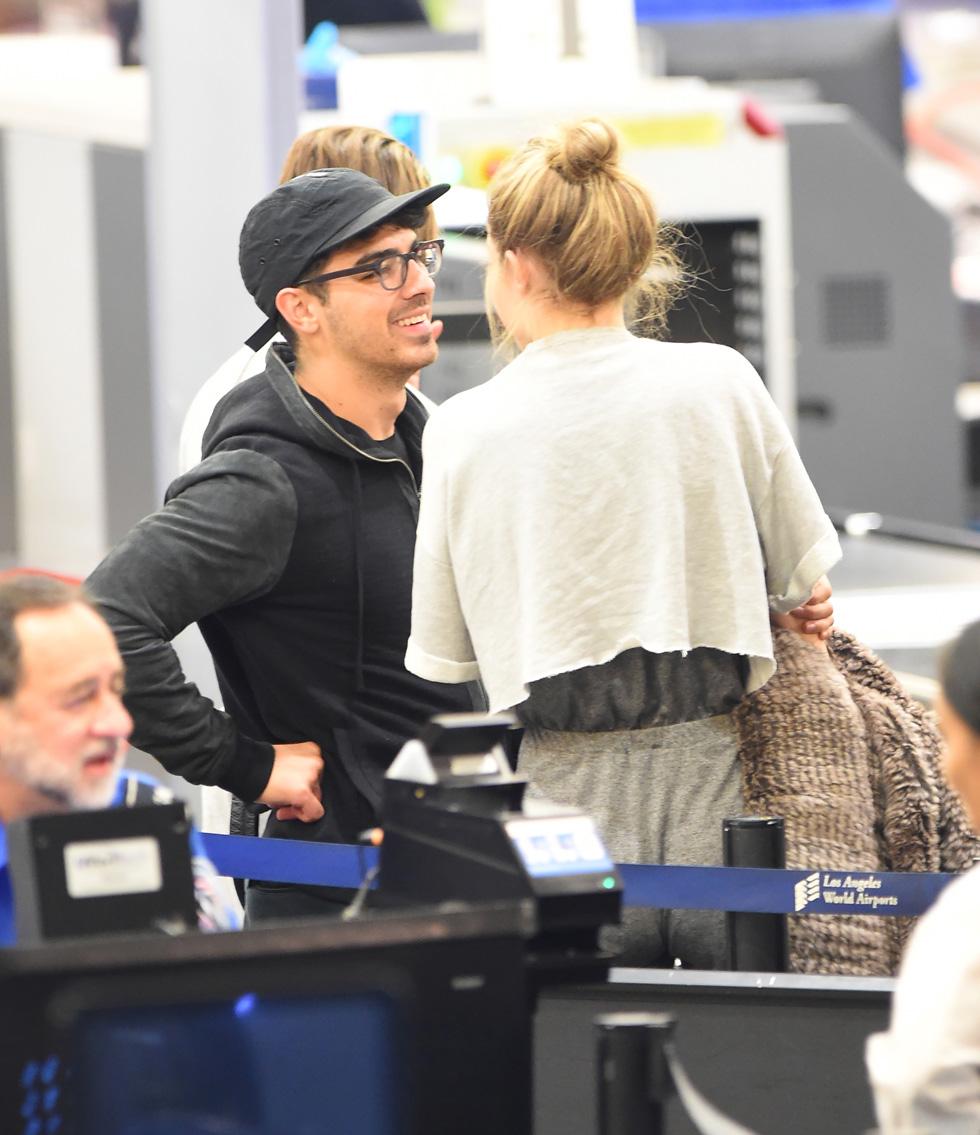 *EXCLUSIVE* Gigi Hadid and Joe Jonas affectionate as they depart LAX **NO UK**