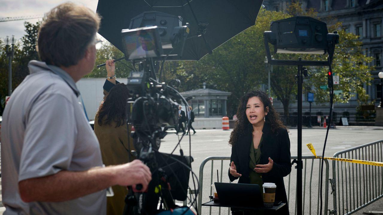 Photo of a reporter delivering a news report