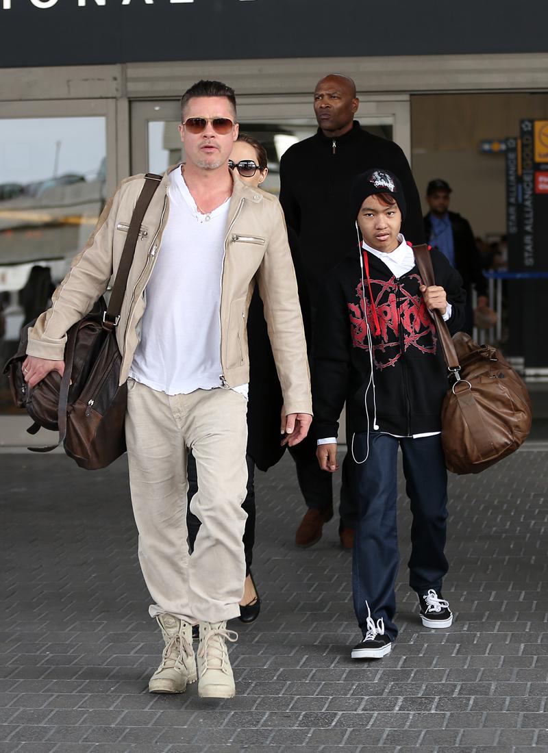 Brad Pitt and Angelina Jolie arrive at LAX airport with son Maddox after a trip to London