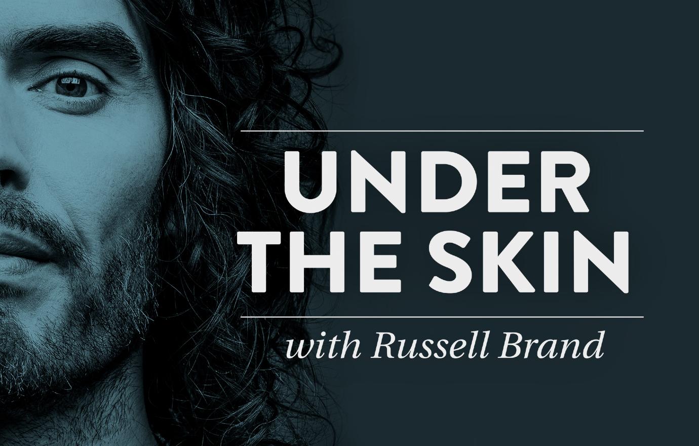 Actor/Comedian Russell Brand stared into the camera with his long locks flowing in a still for his podcast.