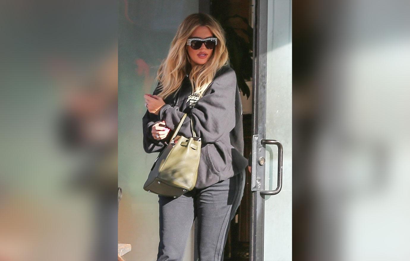 Khloe kardashian hides baby bump