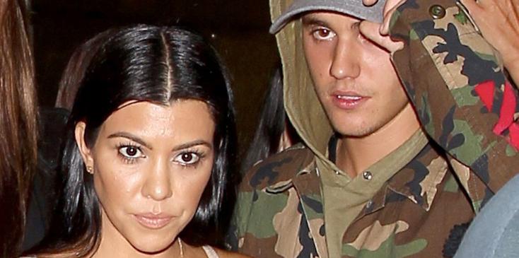 Kourtney Kardashian and Justin Bieber looking happy walking out of The Good Guy together