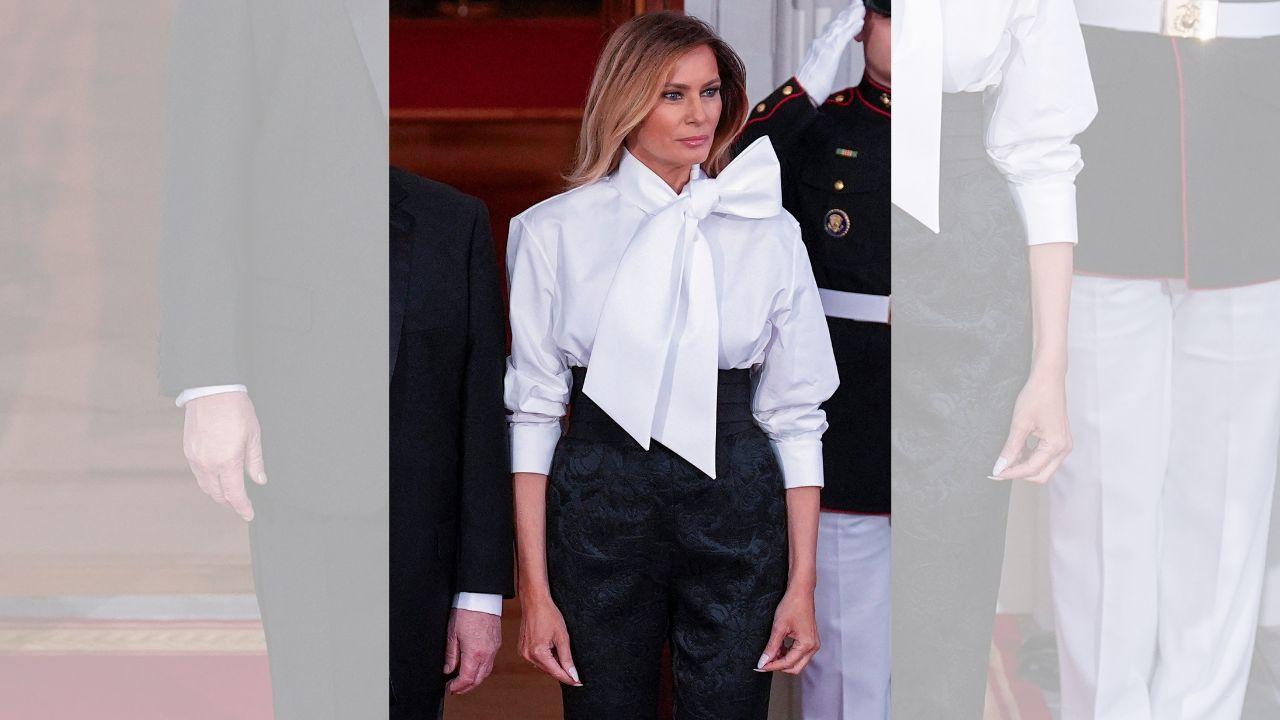 Image of Melania Trump wore a monochrome ensemble featuring a Saint Laurent blouse, Dolce & Gabbana pants, black pointed-toe heels and diamond earrings.