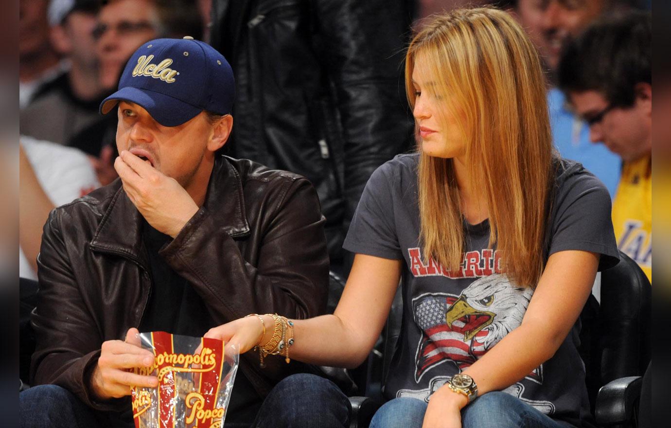 LEO SHARES HIS POPCORN WITH BAR AT THE LAKERS GAME