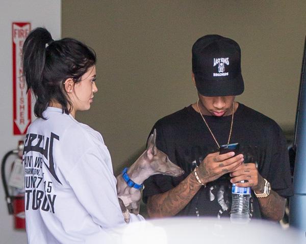 Make up free Kylie Jenner and Tyga and Kylie&#8217;s dog Norman seen at the car dealer in Calabasas, CA