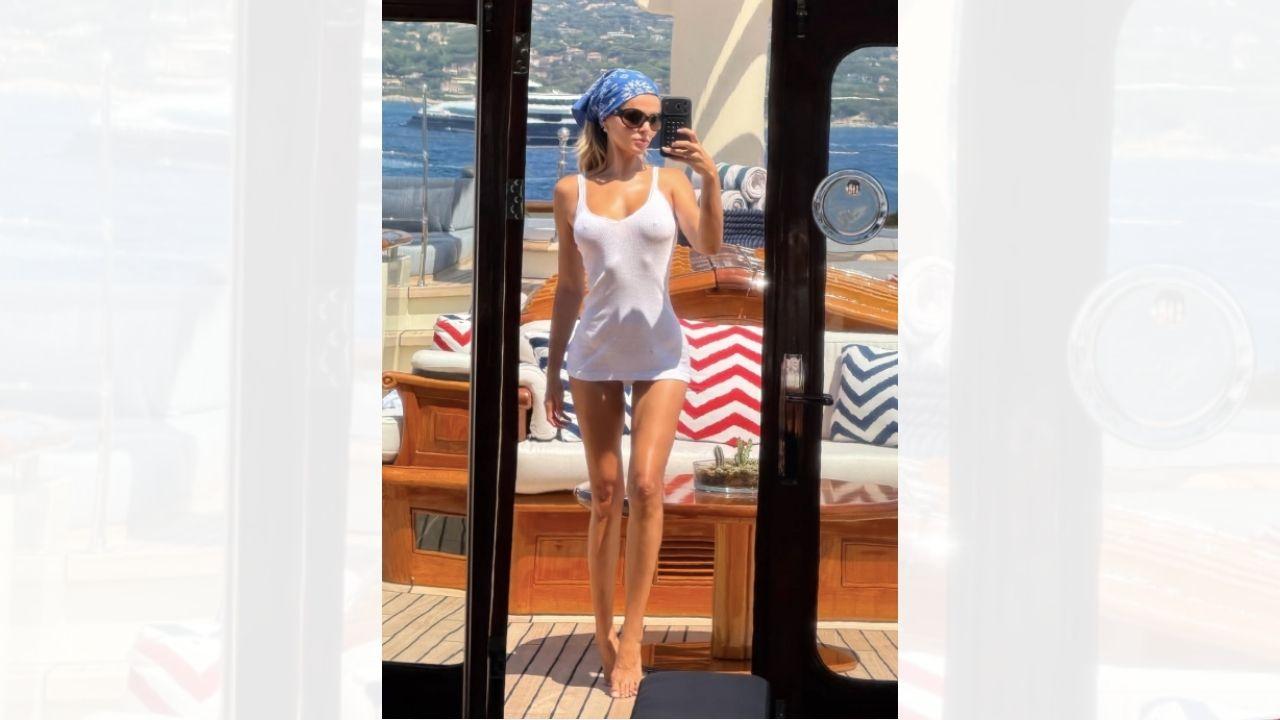 Image of Brooks Nader ditched her top while in Italy with her family.