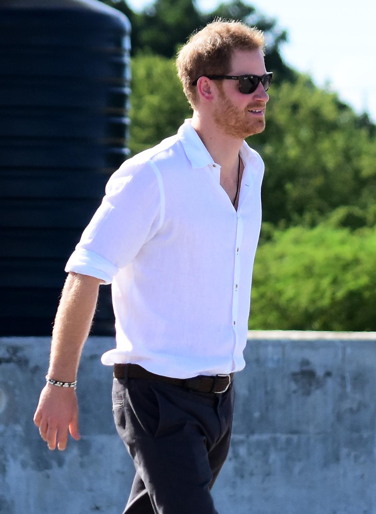 Prince Harry pictured boarding a boat in Barbuda to see the Frigate birds throughout the mangroves