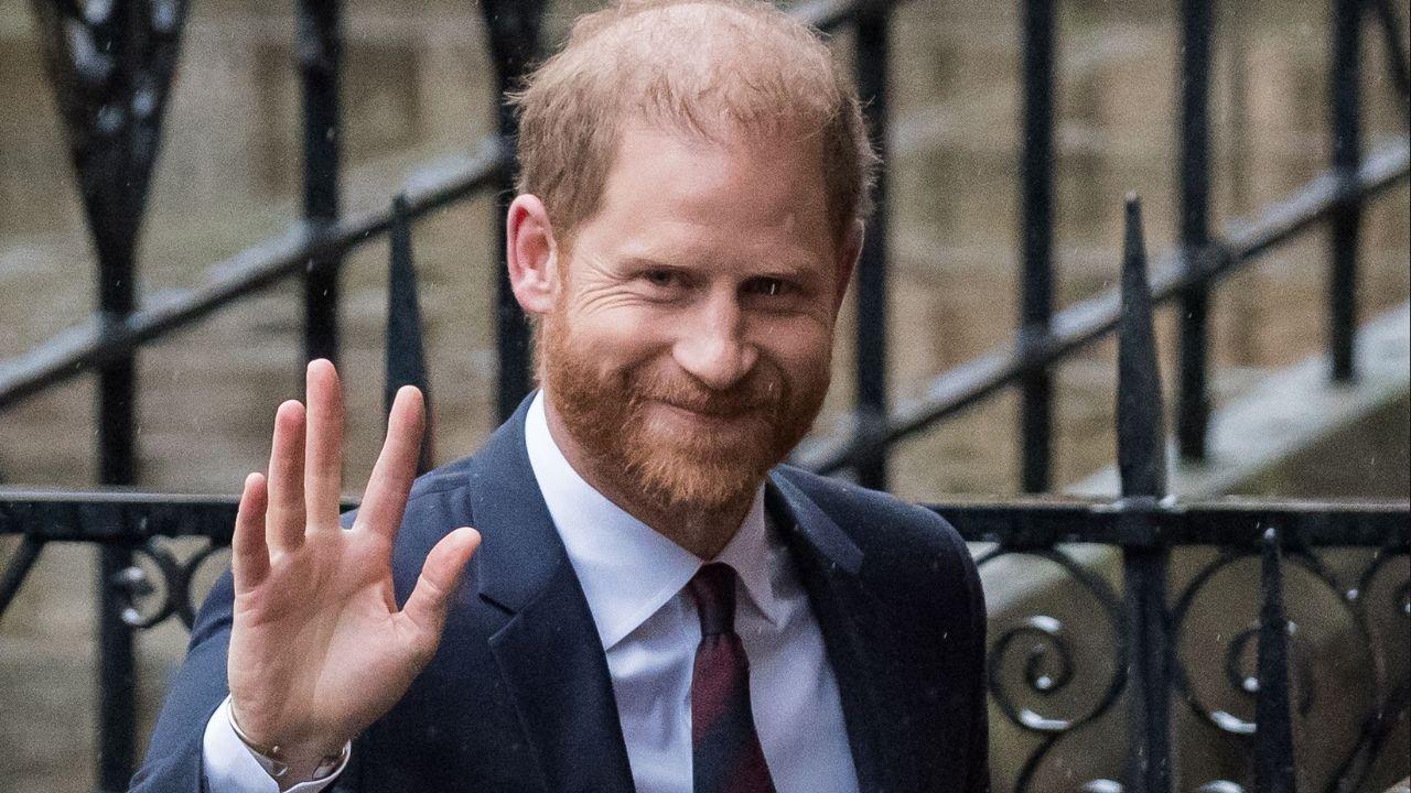 Prince Harry waving at reporters