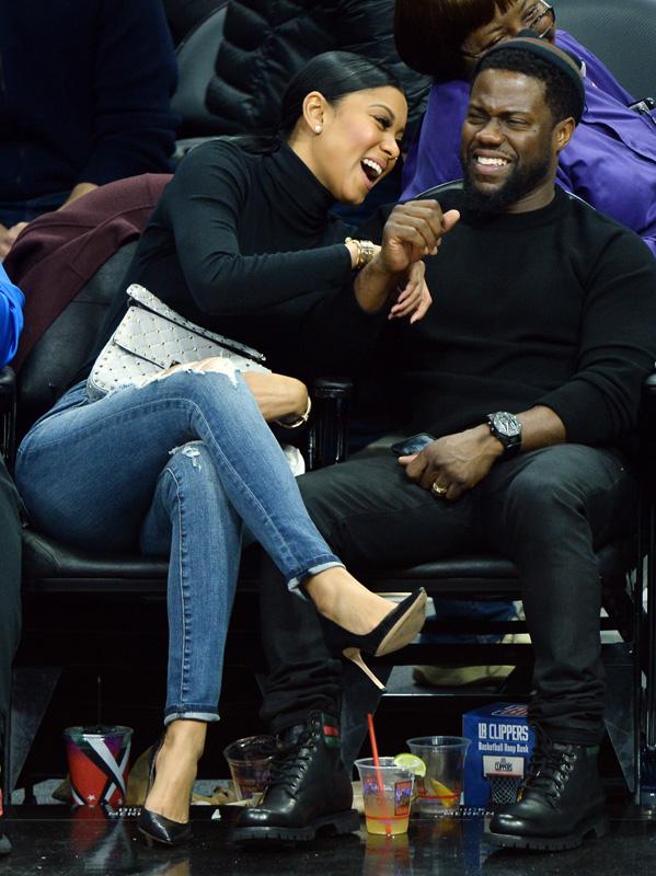 Kevin Hart and wife Eniko Parrish having a good laugh courtside at the Clippers game