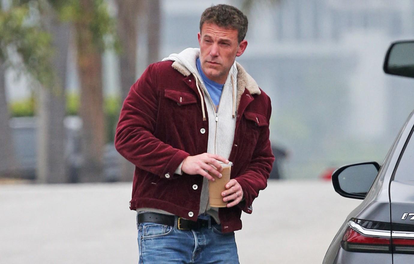 Photo of Ben Affleck in red jacket and jeans.