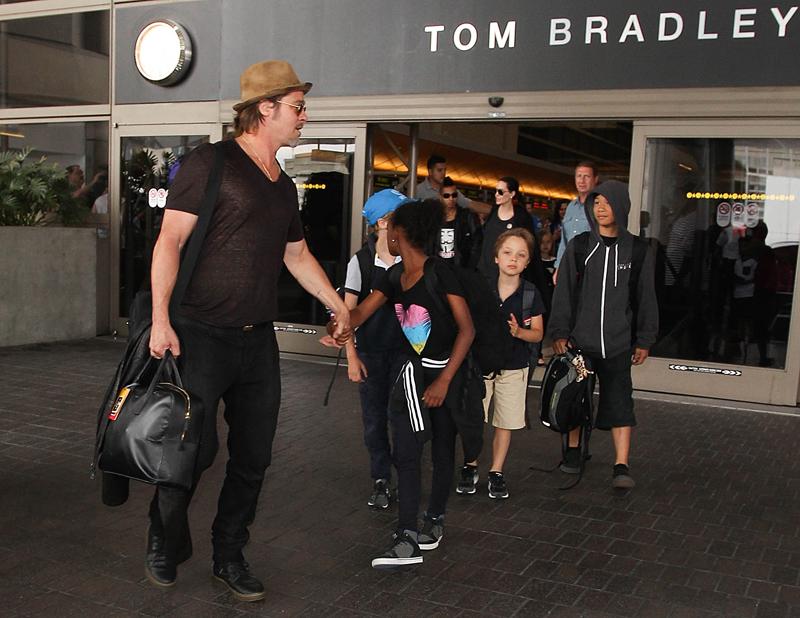 Brad Pitt and Angelina Jolie are seen at LAX