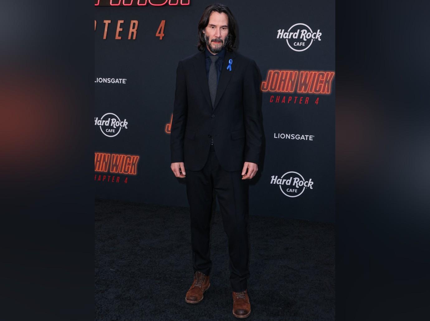 Why Keanu Reeves wore blue ribbon to 'John Wick 4' premiere - Los Angeles Times