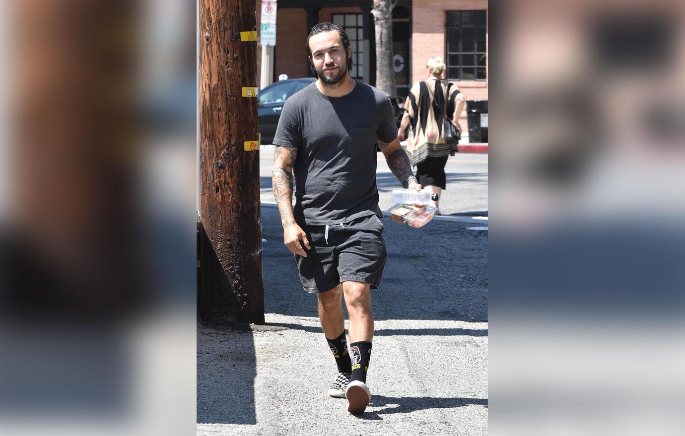 pete wentz smiling and walking