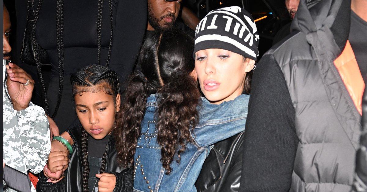 Photo of Bianca Censori covered up while out with her three youngest stepchildren.