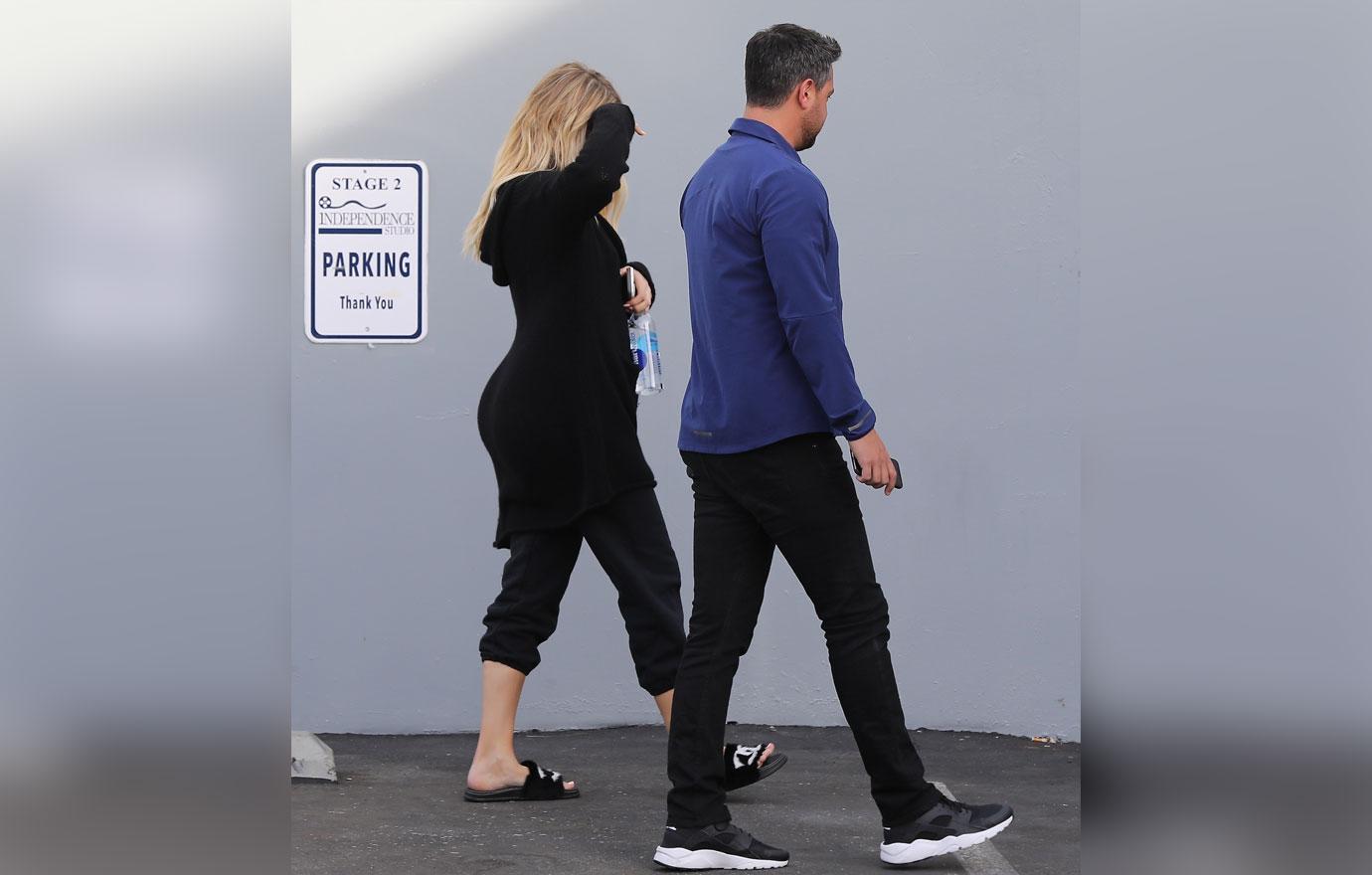 Khloe Kardashian Hides Baby Bump Coat 1