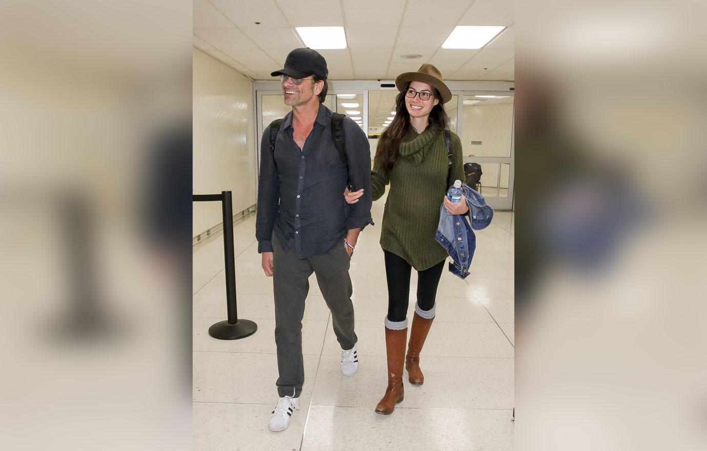 John Stamos and girlfriend Caitlin McHugh at LAX International Airport