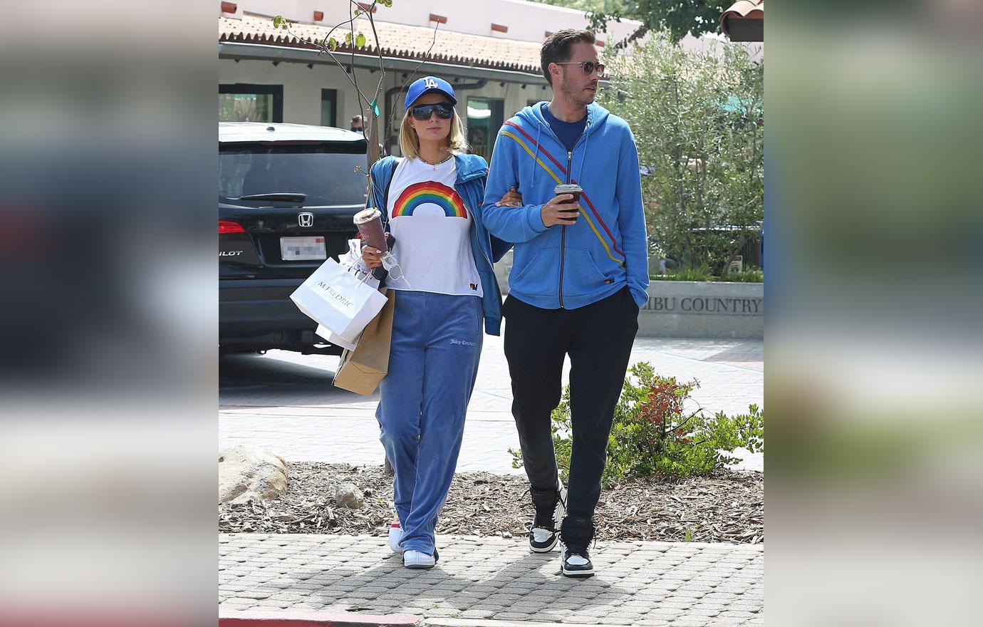 Paris Hilton and fiancé Carter Reum wear matching tracksuits