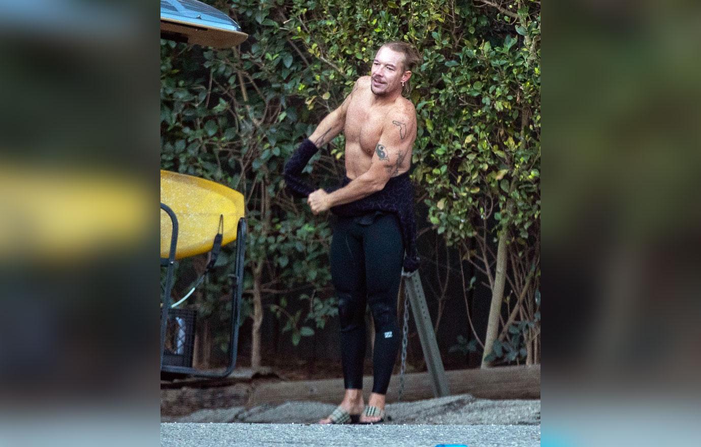 diplo shows amazing body tattoos surfing malibu