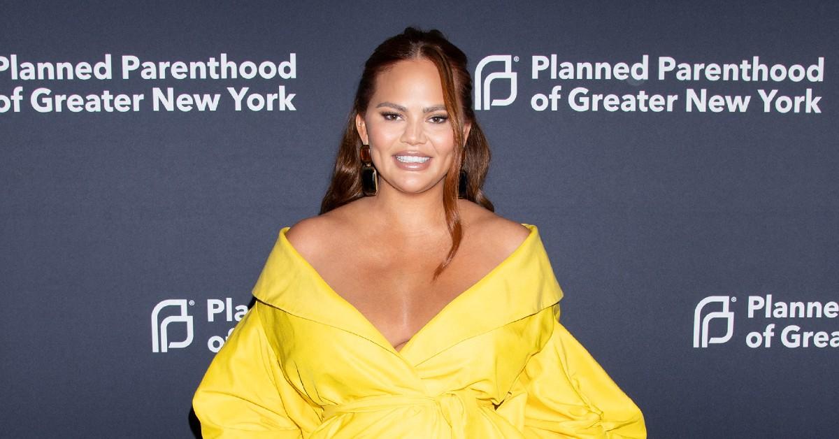 Chrissy Teigen Smiles Through a Nip Slip in NYC