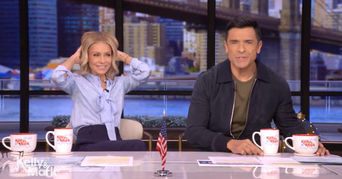 Image of Kelly Ripa was still adjusting her pants after sitting down at her studio desk.