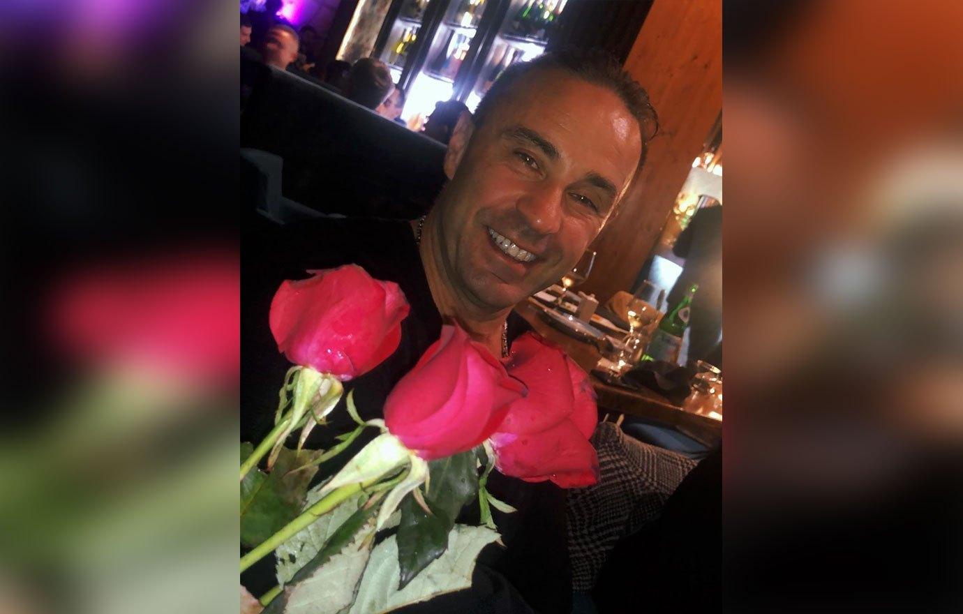 Joe Giudice At A Table With Red Roses Teresa Giudice Daughters