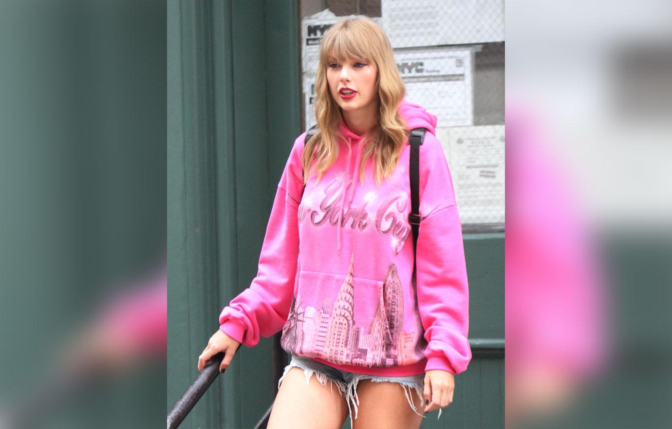 Taylor in pink sweater shirt