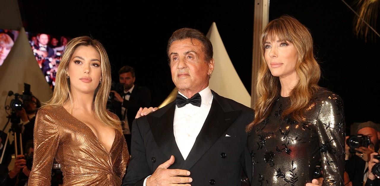 Sylvester Stallone cuddles up to his three girls during family getaway